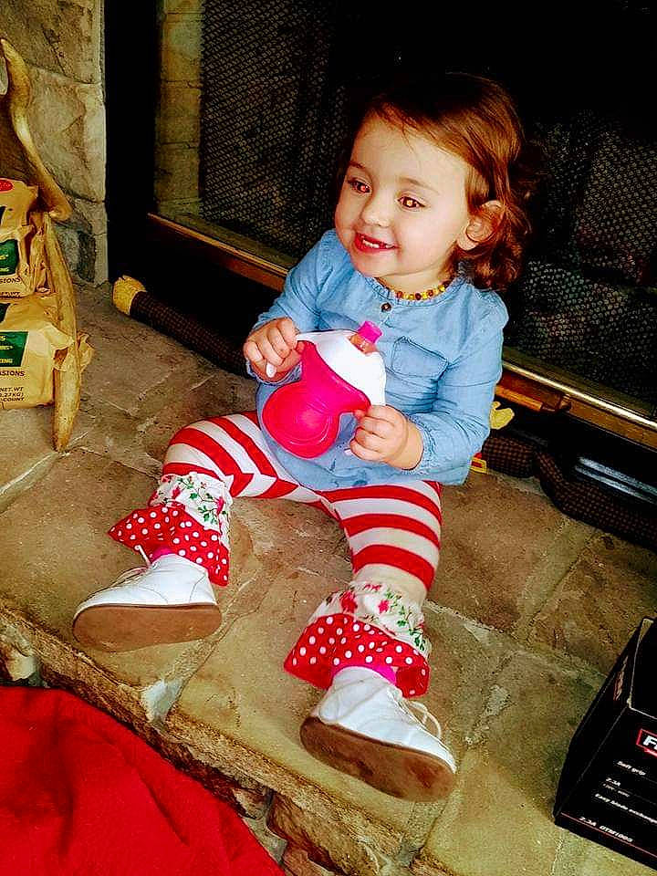 Hyleigh is registered to the contest to win money with this photo: child, christmas, christmas_eve, joy, person, play, sitting, toddler