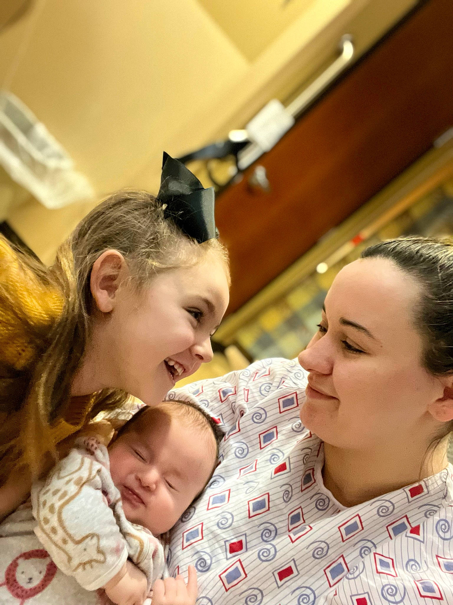 Hyleigh is registered to the contest to win money with this photo: baby, cheek, child, comfort, ear, event, eye, facial_expression, fun, gesture, happy, human, interaction, joy, mammal, mouth, person, playing_with_kids, skin, smile