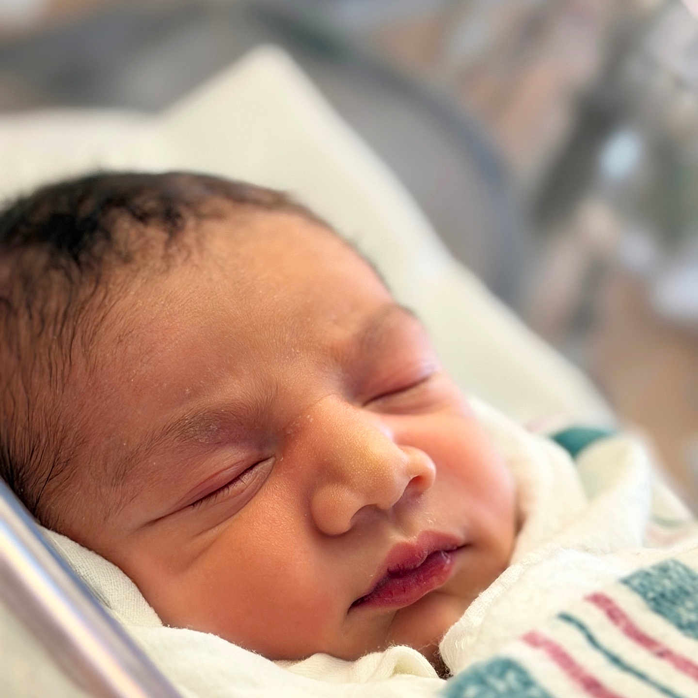 Fariz is registered to the contest to win money with this photo: baby, blanket, child, closeup, cute, delicate, face, head, hospital, indoors, infant, newborn, peaceful, portrait, resting, skin, sleeping, soft_light, wrapped, young