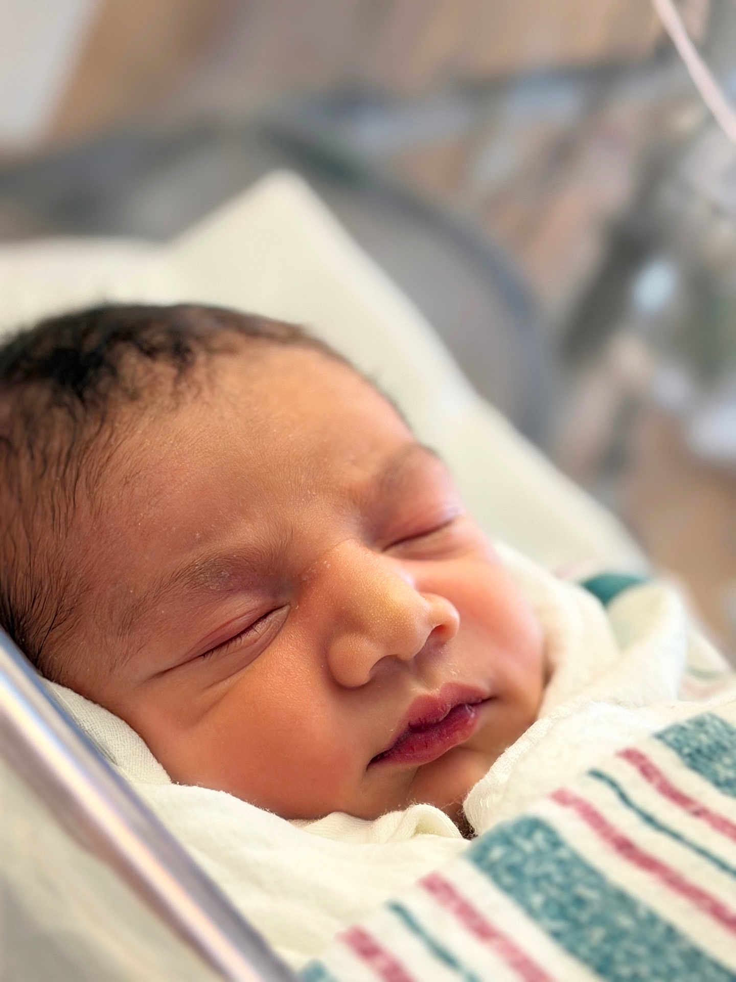 Fariz is registered to the contest to win money with this photo: newborn, baby, sleeping, blanket, hospital, infant, face, closeup, peaceful, soft_light, wrapped, child, portrait, skin, head, cute, young, indoors, resting, delicate