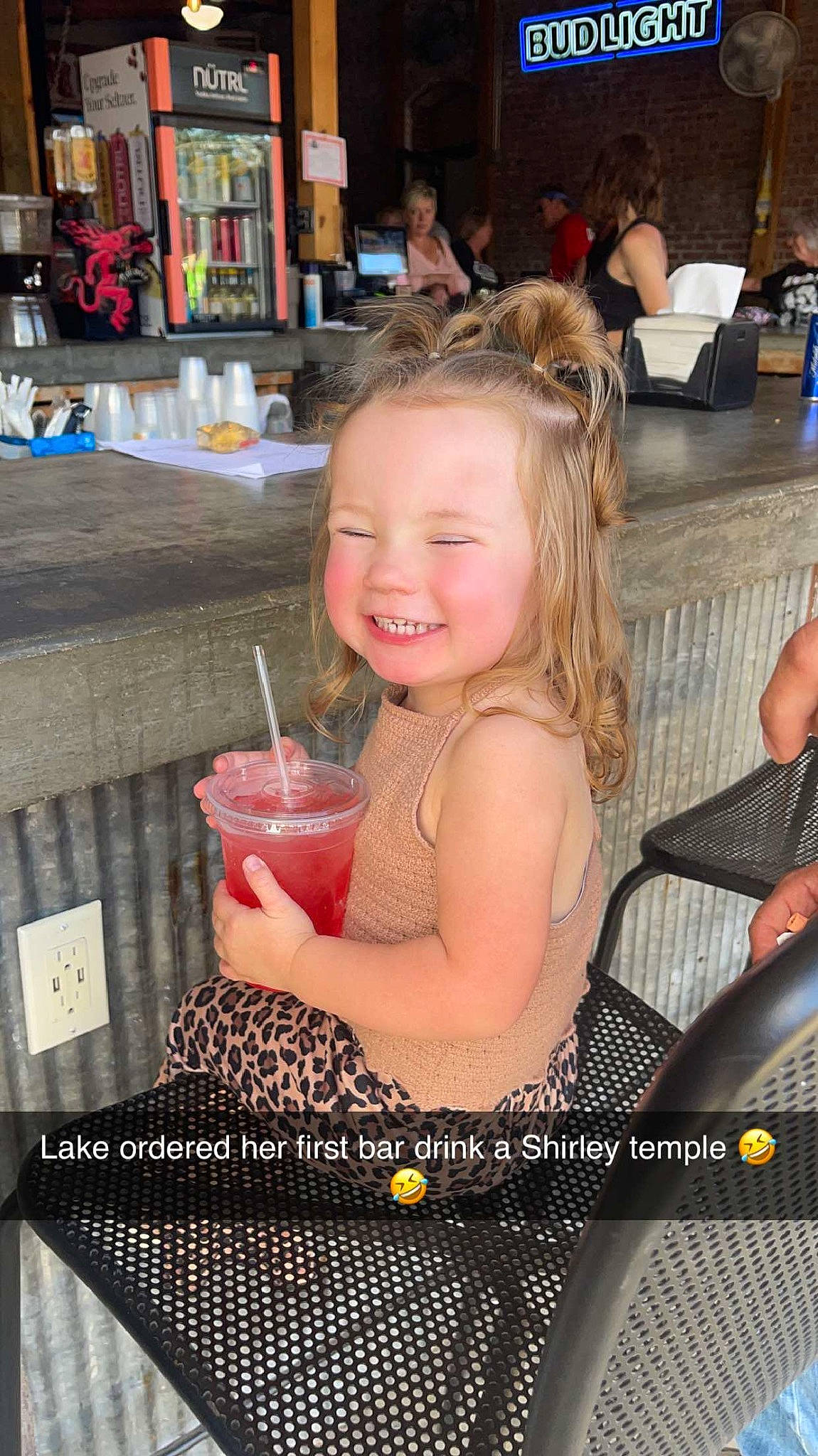 Lakelynn is registered to the contest to win money with this photo: arm, bay_breeze, chair, child, cocktail, daiquiri, drink, drinking, drinking_straw, event, fruit, fun, happy, joy, juice, person, sea_breeze, smile, strawberry_juice, table