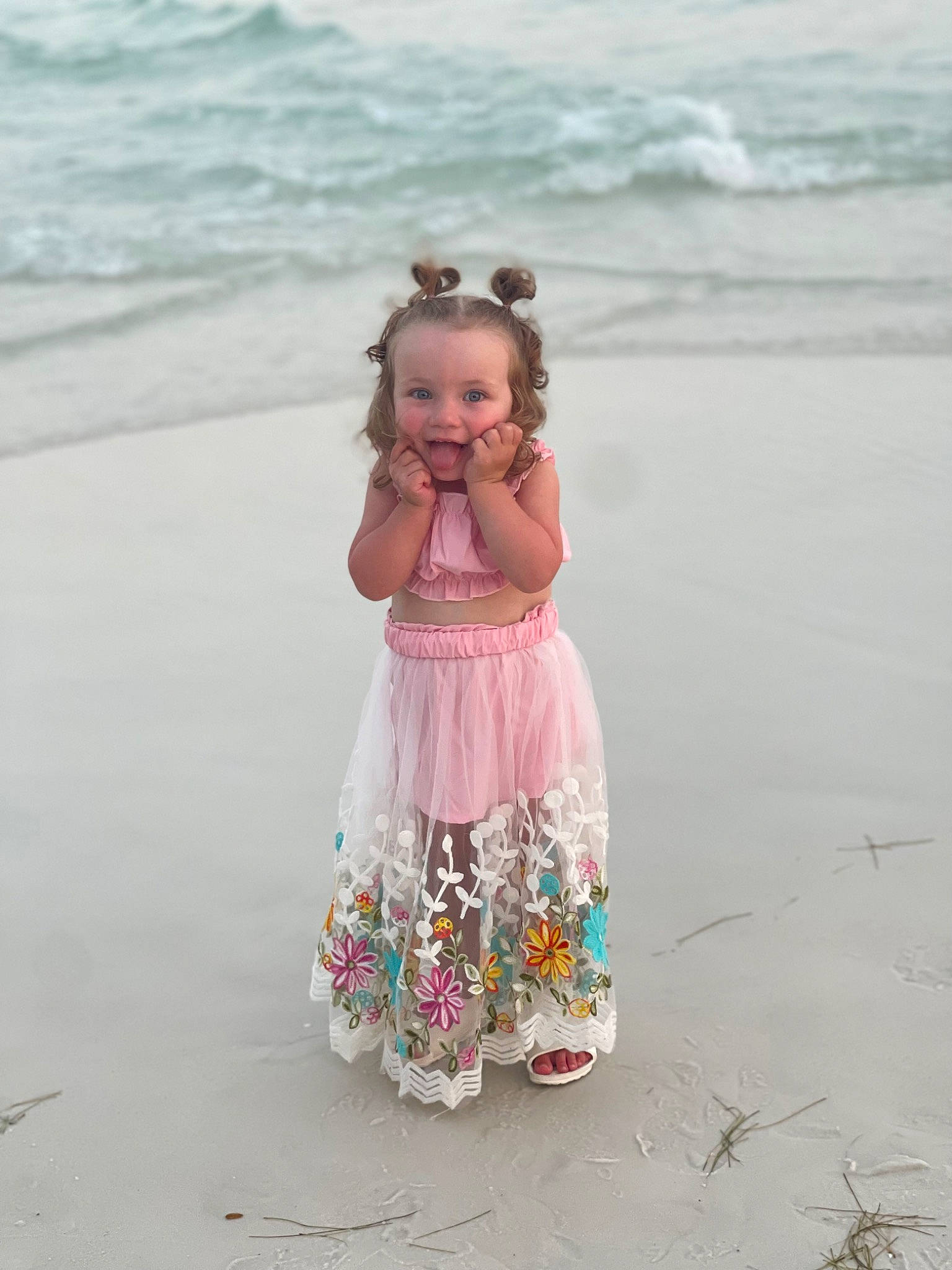 Lakelynn is registered to the contest to win money with this photo: baby_toddler_clothing, beach, coast, coastal_and_oceanic_landforms, day_dress, dress, face, fun, happy, head, people_in_nature, people_on_beach, person, sand, shore, sleeve, summer, toddler, travel, water