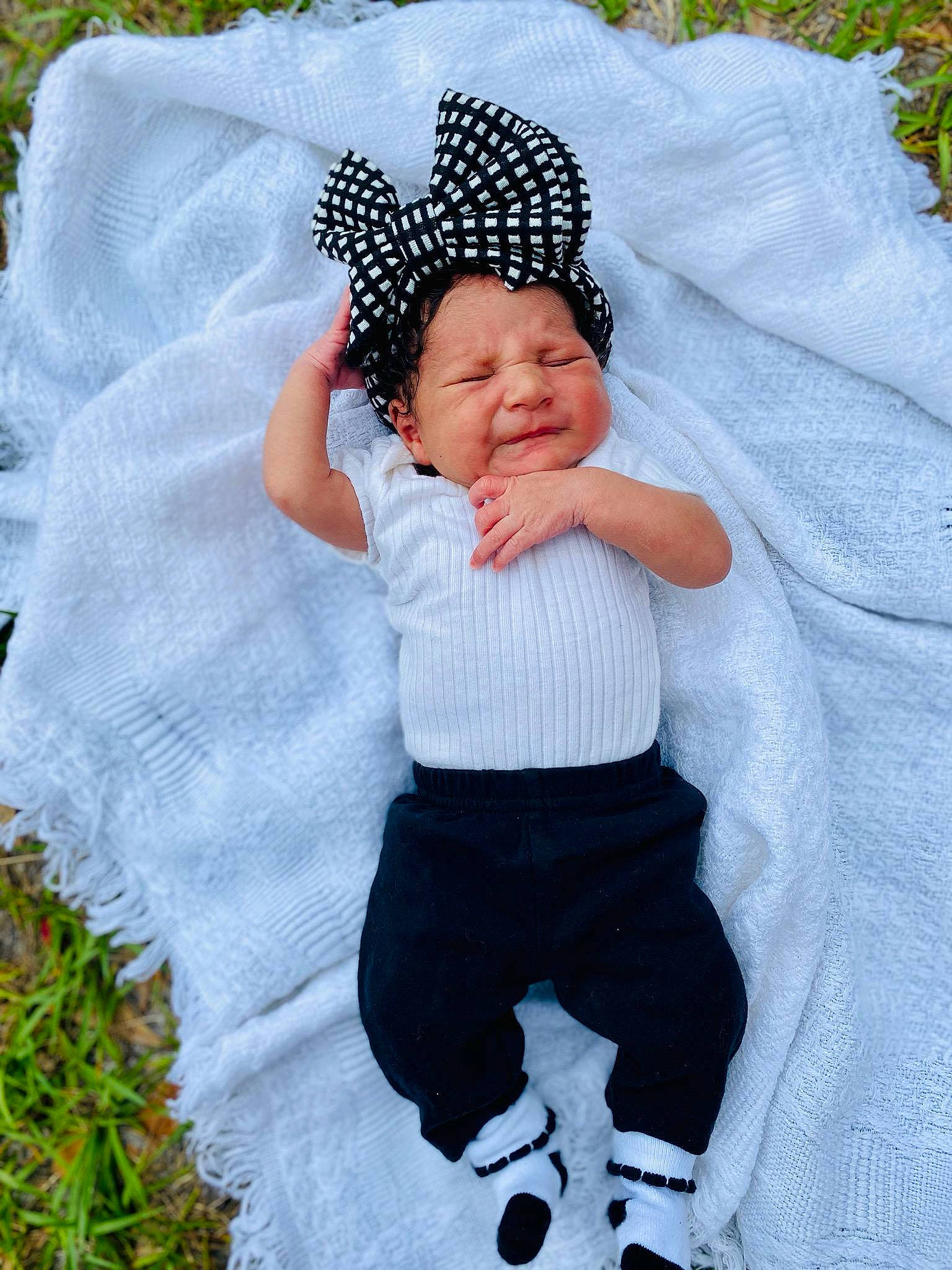 Alaeyjah is registered to the contest to win money with this photo: arm, azure, baby, baby_toddler_clothing, cap, child, comfort, fun, grass, hand, headgear, outerwear, pattern, people_in_nature, person, product, sleeve, sorrow, t_shirt, textile