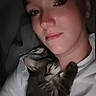 Little Girl is registered to the contest to win money with this photo: woman, kitten, cat, sleeping, close_up, portrait, indoor, tshirt, face, pet, animal, dark_background, cozy, cuddling, human, resting, comfort, eyelids, expressionless, soft_light