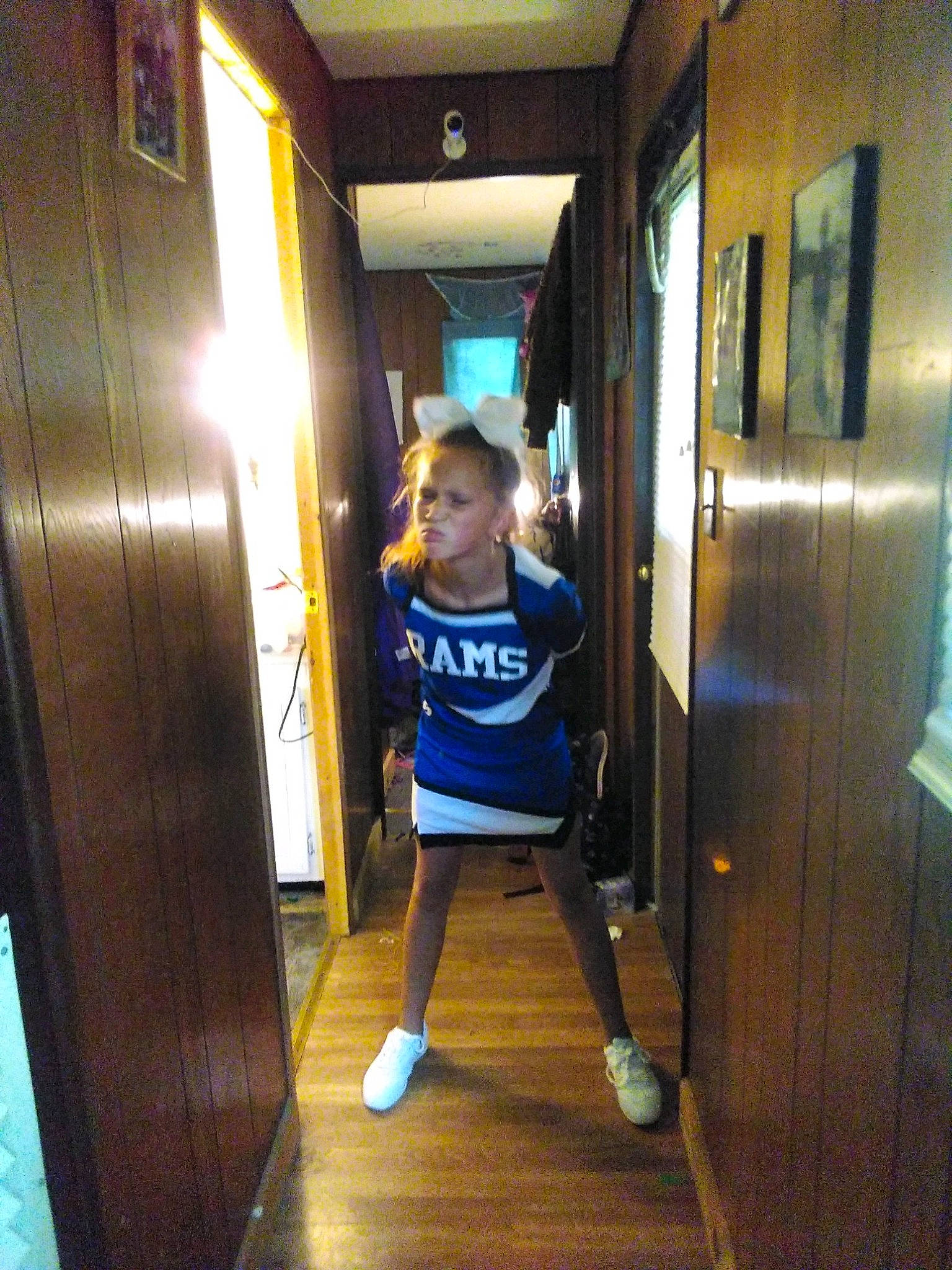 La'Kesha is registered to the contest to win money with this photo: door, door_handle, electric_blue, floor, flooring, fun, hardwood, home_door, human_leg, knee, leisure, person, recreation, room, shorts, sportswear, sunglasses, t_shirt, thigh, varnish