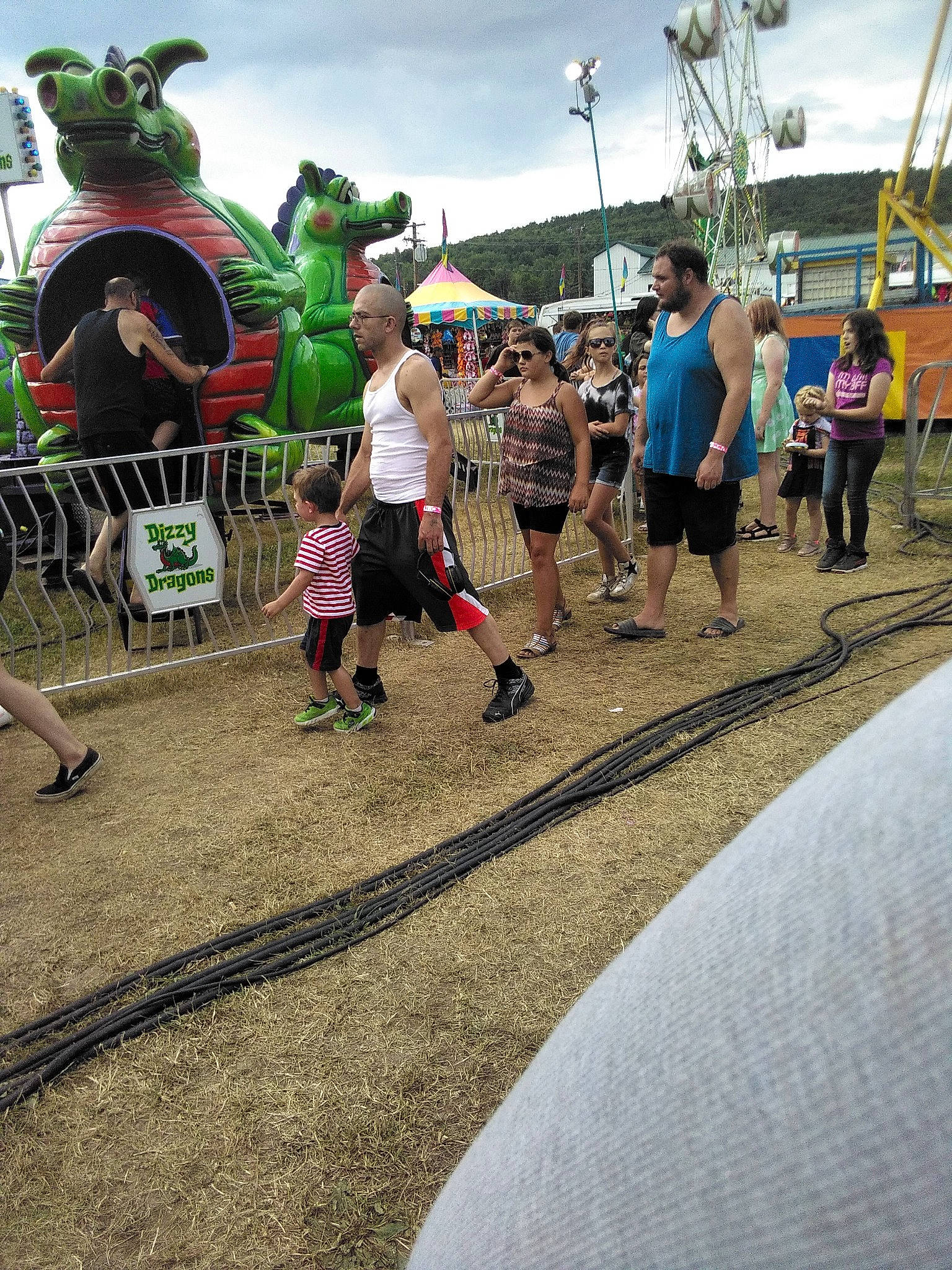 Stephanie joined the competition — help win amazing prizes! asphalt, boot, child, city, crowd, event, fun, grass, leisure, luggage_and_bags, pedestrian, person, plant, pole, recreation, road, shorts, sky, team, tree