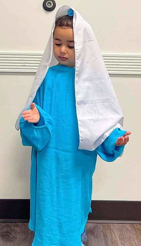 Daniella joined the competition — help win amazing prizes! aqua, arm, azure, baby, costume, electric_blue, event, fashion_accessory, fashion_design, formal_wear, gesture, hand, headgear, outerwear, peach, person, room, service, shoulder, sleeve