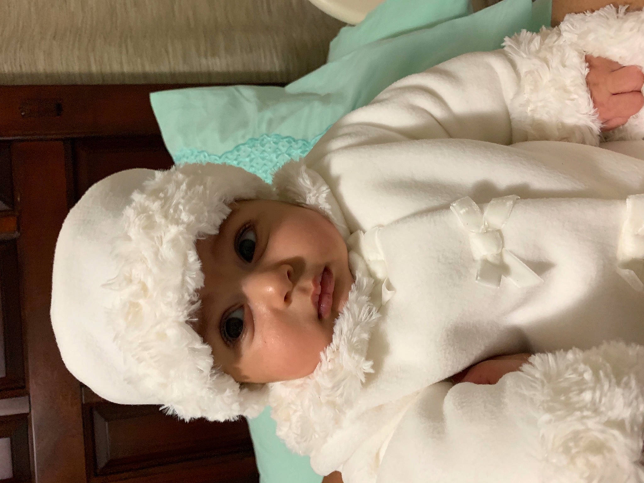 Daniella joined the competition — help win amazing prizes! baby, baby_toddler_clothing, costume_accessory, embellishment, fur, headwear, linens, person, wood_stain