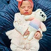 Ayzal joined the competition — help win amazing prizes! baby, sleeping, infant, pink_bow, headband, knitted_toy, teddy_bear, pastel_clothing, blanket, soft_texture, cute, peaceful, child, portrait, indoors, hand, face, closed_eyes, tulle_skirt, cozy