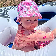 Lainey joined the competition — help win amazing prizes! baby, cap, car, clothing, face, glove, hat, head, lifejacket, outdoors, person, photography, portrait, summer, sunhat, swimwear, transportation, vehicle, vest, water