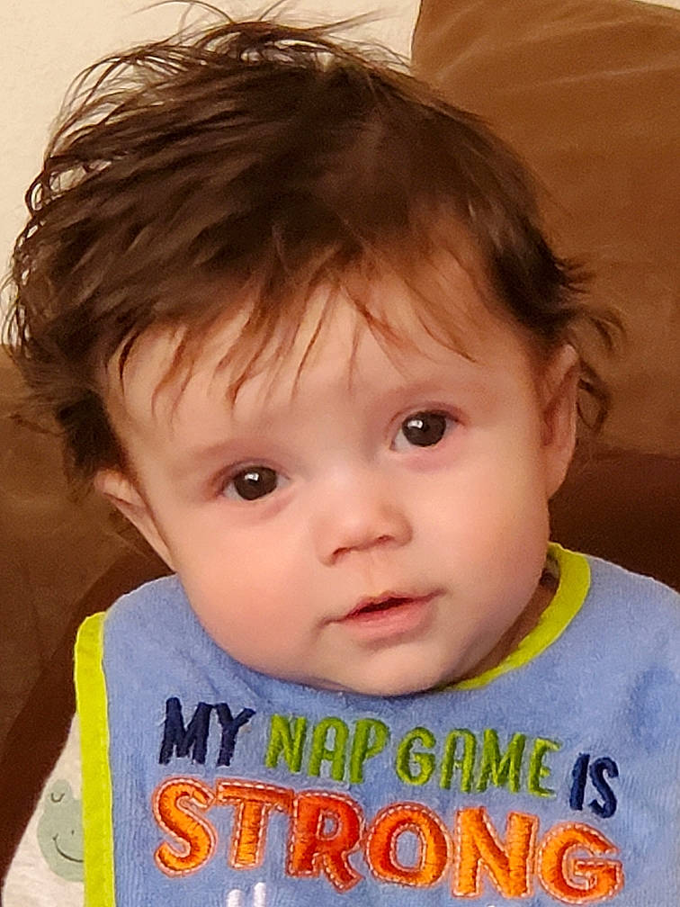 Rowin is registered to the contest to win money with this photo: baby_toddler_clothing, cheek, chin, cool, ear, eye, eyebrow, eyelash, face, forehead, happy, human_body, iris, lip, mouth, neck, nose, person, skin, sleeve