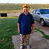 Christopher joined the competition — help win amazing prizes! boy, car, child, clothing, face, grass, hardhat, head, helmet, male, pants, path, person, photography, plant, portrait, sedan, suv, transportation, vehicle
