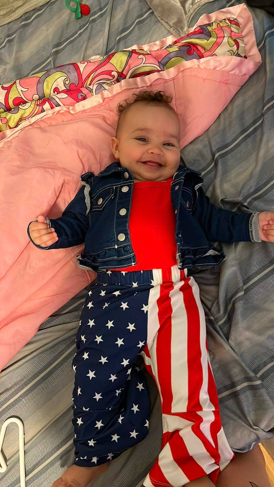 Lakyn is registered to the contest to win money with this photo: baby, baby_toddler_clothing, child, comfort, event, fashion_accessory, fashion_design, fun, happy, joy, leisure, orange, pattern, person, sitting, sleeve, smile, street_fashion, textile, toddler