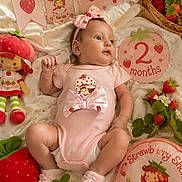 Star joined the competition — help win amazing prizes! baby, basket, blanket, celebration, child, cute, decorations, face, flowers, headband, infant, lying_down, milestone_sign, onesie, pink_clothing, plush_toy, portrait, socks, soft_toys, strawberry