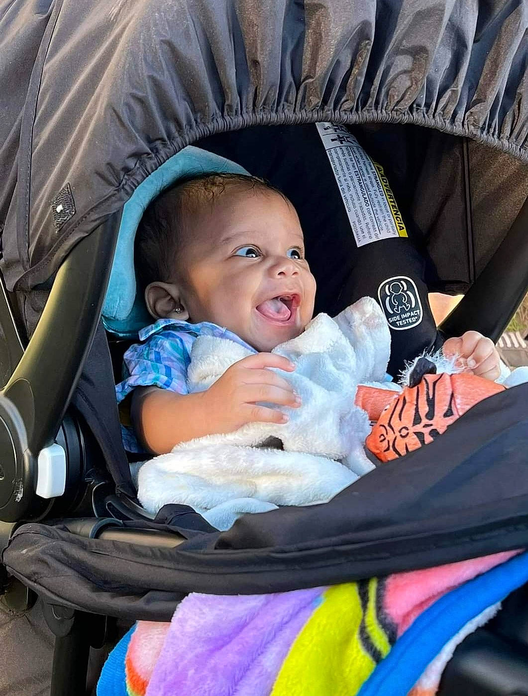 Canaan is registered to the contest to win money with this photo: baby, baby_carriage, baby_products, baby_toddler_clothing, beauty, black, child, comfort, eye, face, facial_expression, hairstyle, human, iris, lap, person, product, sitting, smile, snapshot