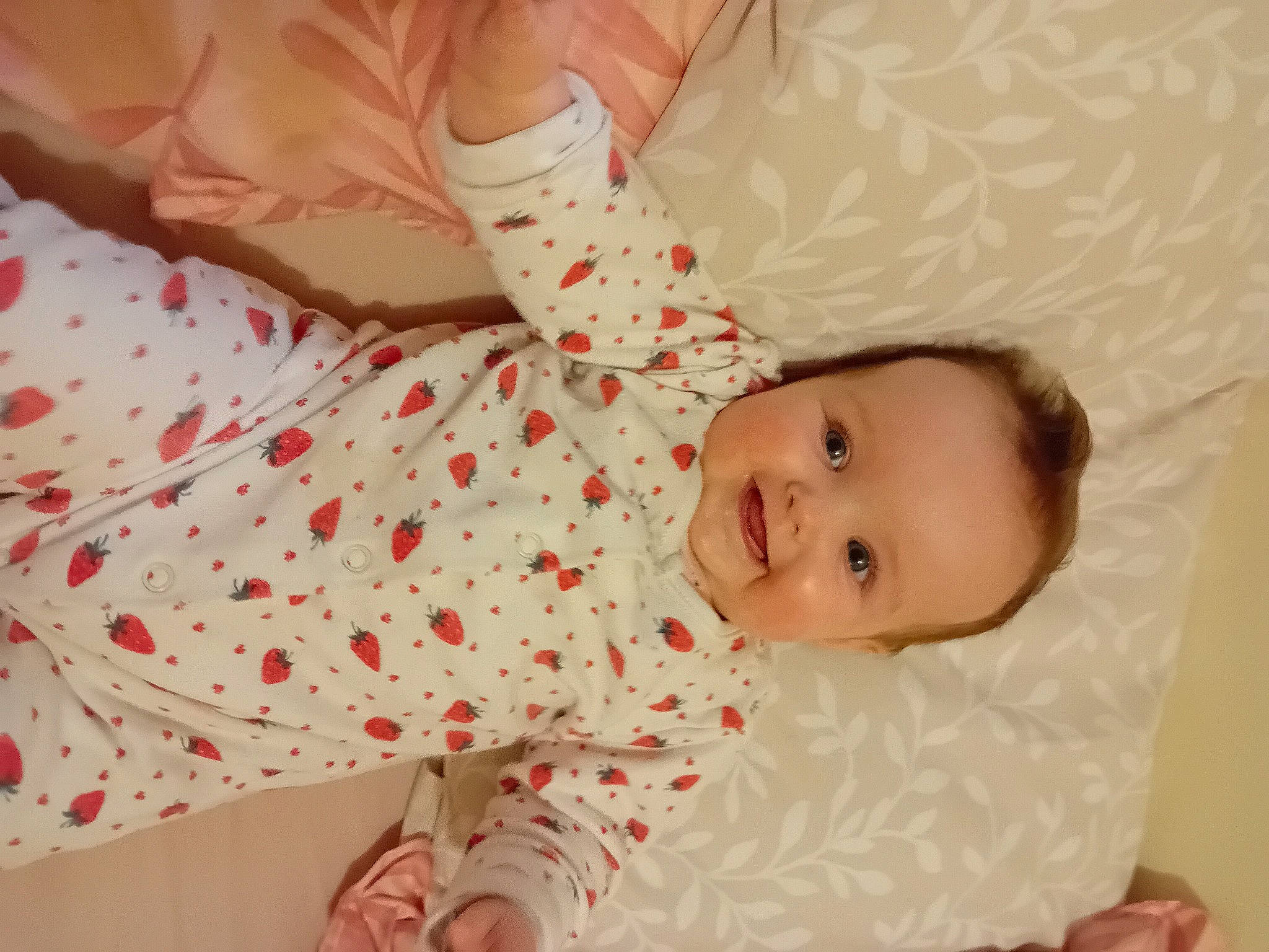 Lottie is registered to the contest to win money with this photo: baby, baby_products, baby_toddler_clothing, bed, bedding, child, comfort, couch, happy, joy, linens, nightwear, pattern, peach, person, pink, room, sitting, skin, sleeve