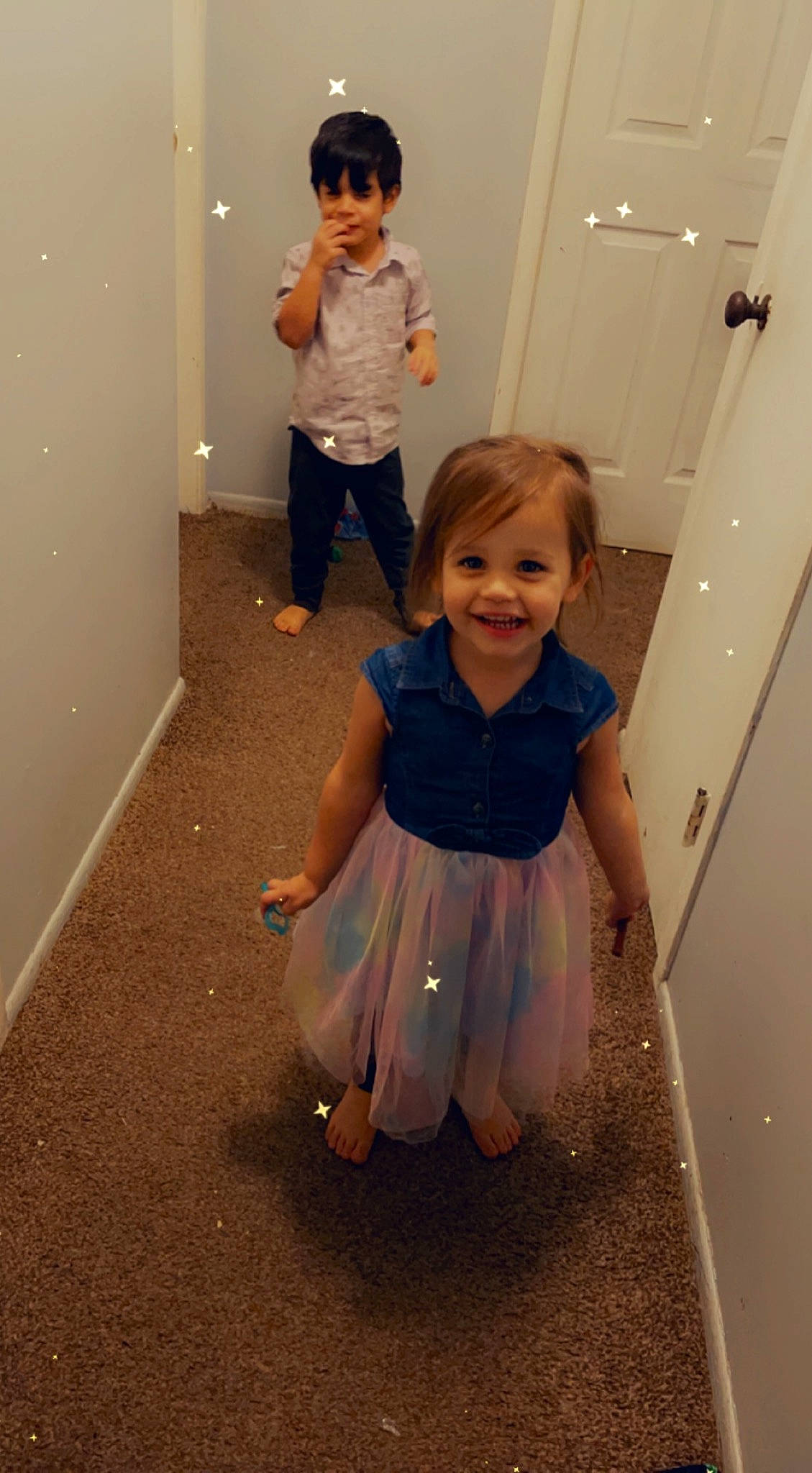 Makennah is registered to the contest to win money with this photo: arm, baby_toddler_clothing, child, door, eye, face, facial_expression, floor, flooring, fun, gesture, hairstyle, happy, joint, joy, people, person, sleeve, smile, standing