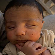 Maher joined the competition — help win amazing prizes! baby, bodypart, clothing, couch, cushion, face, finger, frown, furniture, hand, head, homedecor, knitwear, newborn, person, photography, portrait, sad, sleeping, sweater