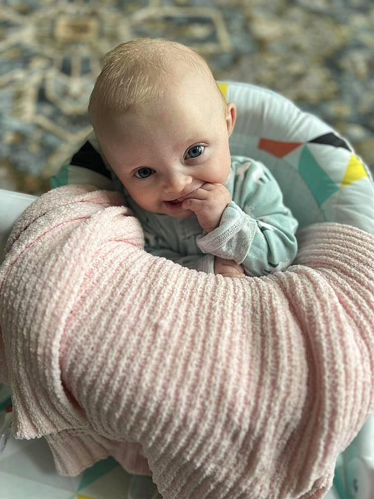 Kaisyn is registered to the contest to win money with this photo: baby, baby_toddler_clothing, beauty, cheek, child, comfort, eye, flooring, grass, grey, happy, outerwear, pattern, person, sitting, skin, sleeve, toddler, wood, wool