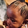 Majestie is registered to the contest to win money with this photo: child, face, hair, orange_bow, close_up, portrait, young, skin, ear, eyelashes, expression, head, profile, indoors, person, cute, childhood, attention, soft_light, blurred_background