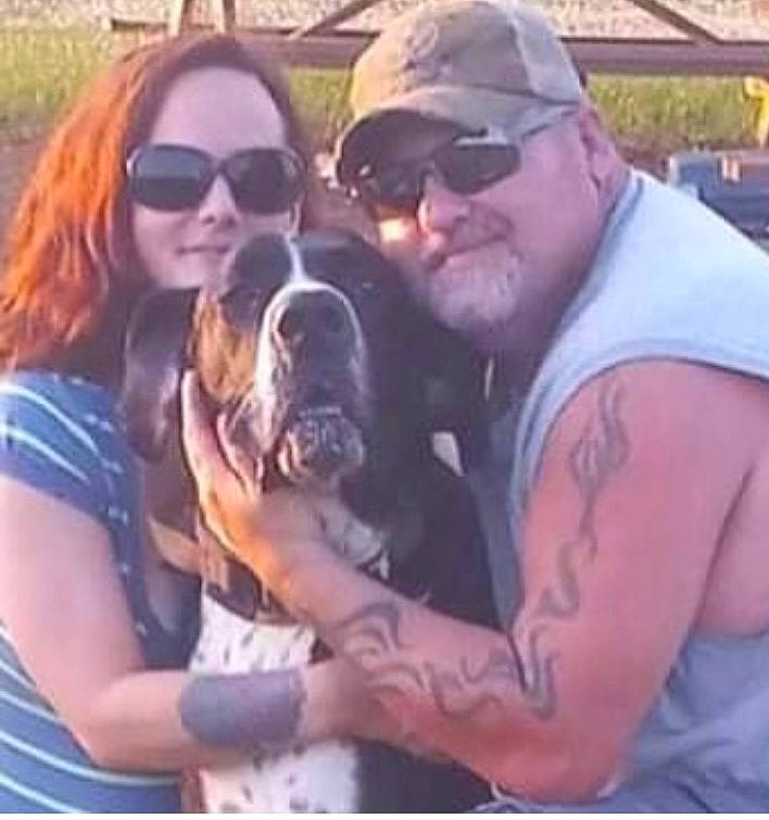 Octo is registered to the contest to win money with this photo: baseball_cap, beard, cap, carnivore, companion_dog, cool, dog, dog_breed, eyewear, face, fawn, goggles, grass, happy, muscle, smile, snout, sunglasses, vision_care, working_animal