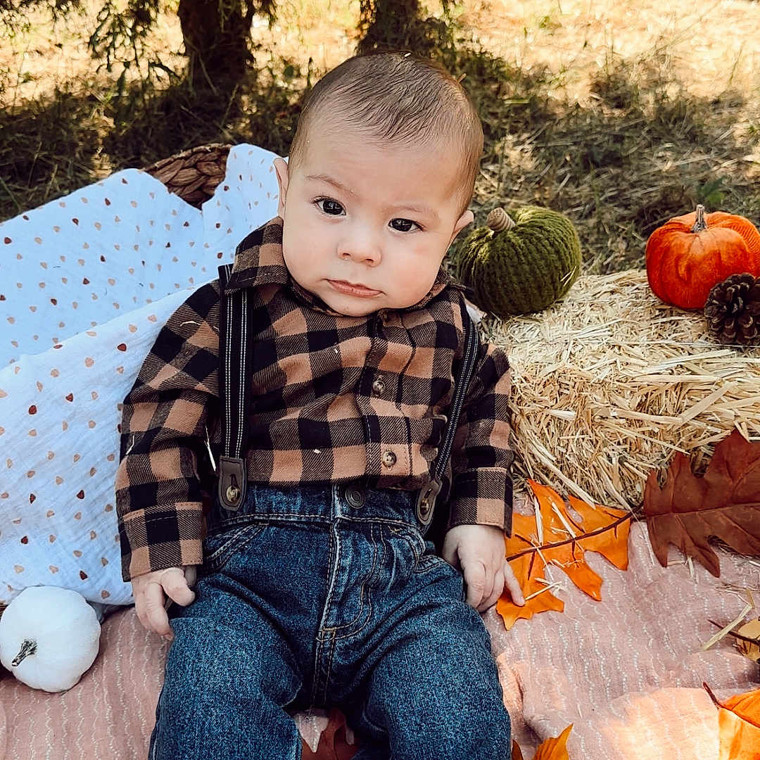 Johnny joined the competition — help win amazing prizes! baby, clothing, face, food, grass, head, jeans, leaf, pants, person, photography, plant, portrait, produce, pumpkin, sitting, squash, tree, vegetable, vegetation