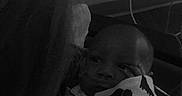 Zayne is registered to the contest to win money with this photo: baby, bed, bedroom, blanket, cushion, face, furniture, happy, head, homedecor, indoors, newborn, person, photography, portrait, quilt, room, sleeping, smile, towel