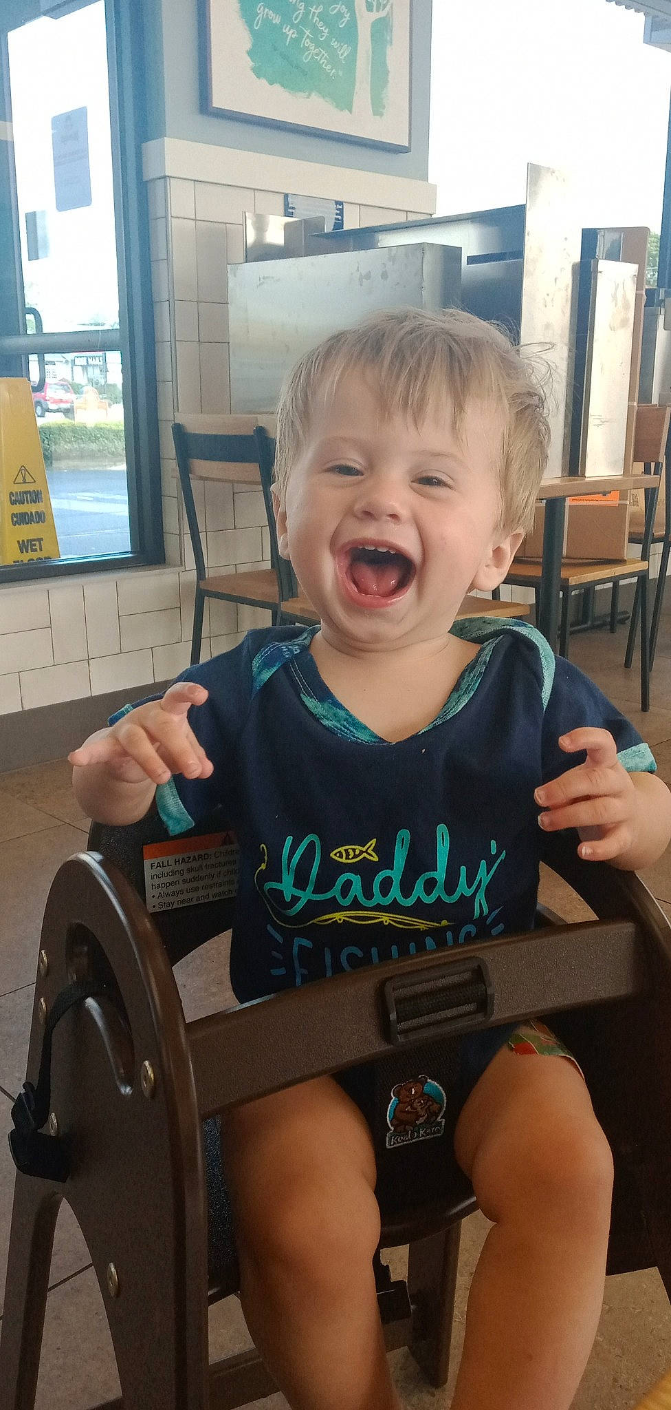 Connor is registered to the contest to win money with this photo: automotive_tire, baby, baby_toddler_clothing, chair, child, eye, facial_expression, fun, hairstyle, happy, head, human_leg, lap, person, skin, smile, t_shirt, thigh, toddler, wheel