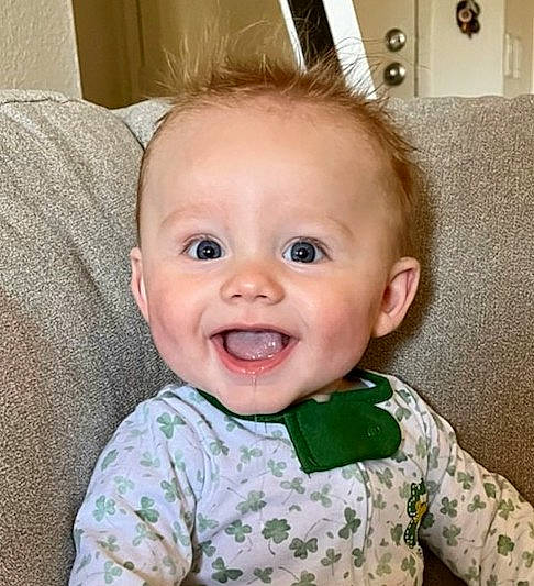 Madden is registered to the contest to win money with this photo: baby, baby_toddler_clothing, cheek, chin, ear, eye, eyebrow, eyelash, happy, head, iris, jaw, lip, mouth, nose, person, skin, sleeve, smile, toddler