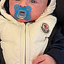 baby, pacifier, white_jacket, hood, blue_pacifier, hands, infant, close_up, face, wide_eyes, curious, warm_clothing, puffy_jacket, zipper, baby_clothing, child, person, cute, indoor, portrait