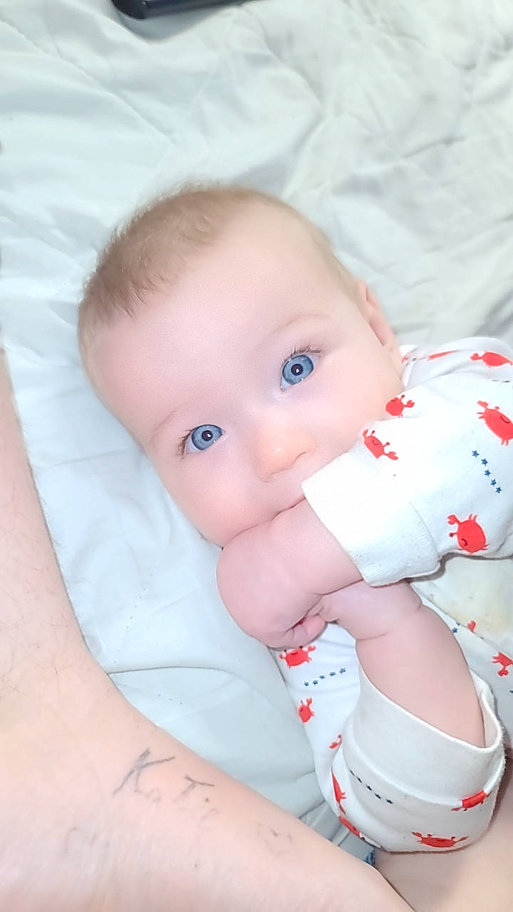 Joycelynn is registered to the contest to win money with this photo: baby, baby_toddler_clothing, carmine, cheek, chest, comfort, eye, happy, human_body, human_leg, lip, mouth, nose, pattern, person, sitting, skin, sleeve, stomach, toddler