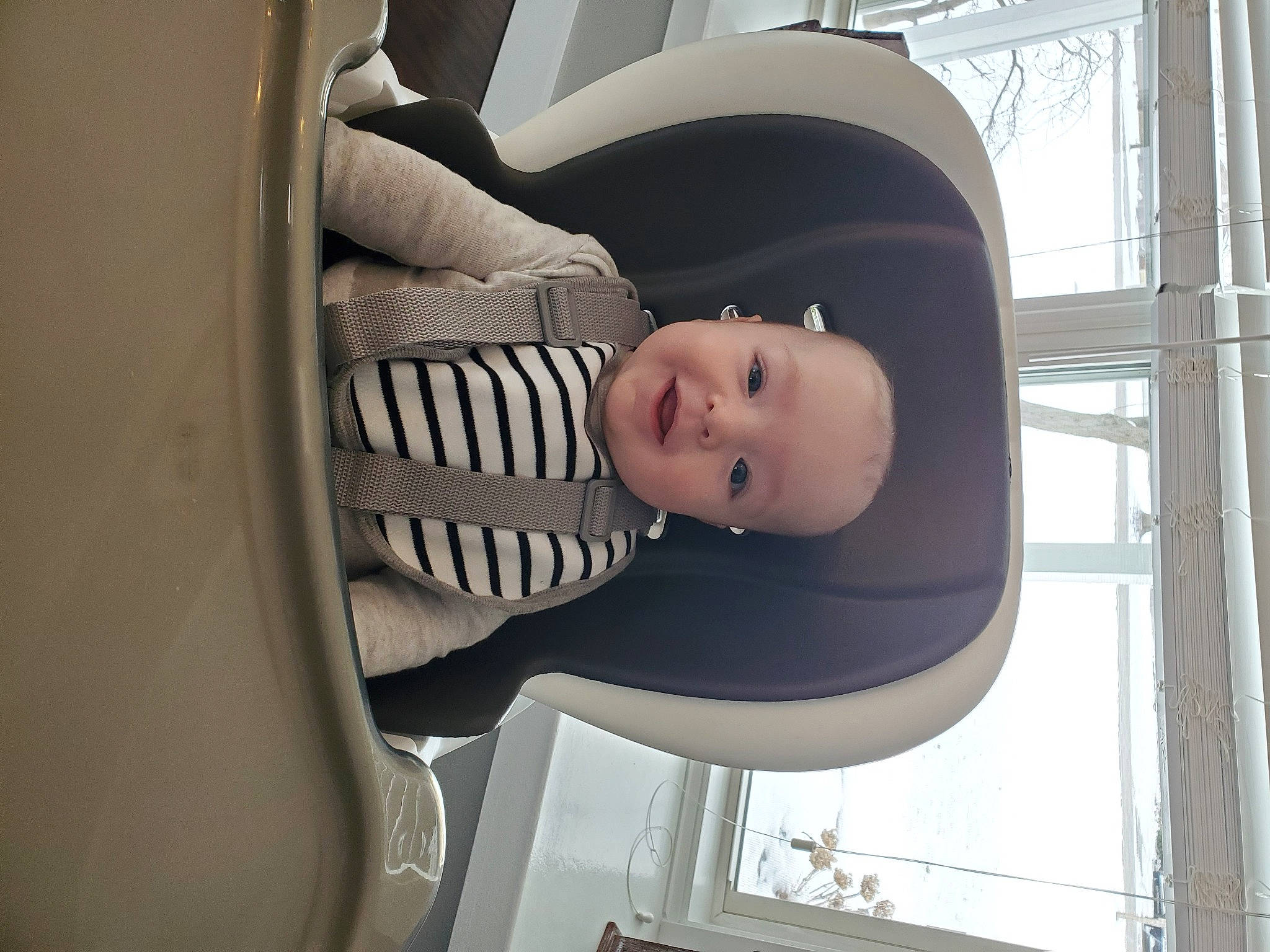 Bentley is registered to the contest to win money with this photo: art, auto_part, automotive_design, automotive_exterior, automotive_lighting, automotive_tire, automotive_wheel_system, baby, baby_products, car_seat, comfort, glass, hat, joy, luxury_vehicle, machine, person, sun_hat, toddler, vehicle_door