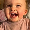 Cheyenne is registered to the contest to win money with this photo: baby, candid, cheerful, child, closeup, cute, expression, face, hair, happy, indoors, person, pigtails, pink, portrait, smiling, sweater, toddler, warm_light, young_child