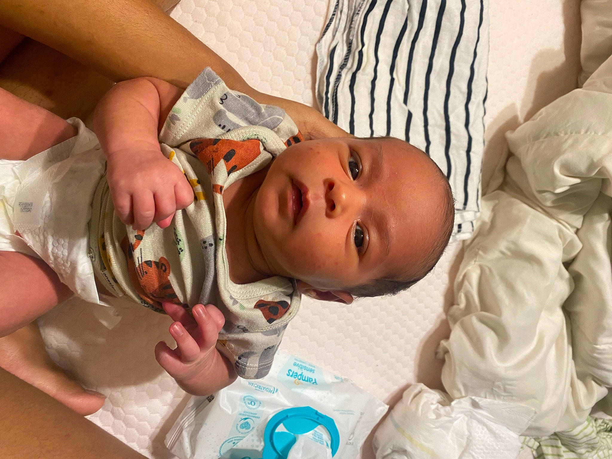 Zakai is registered to the contest to win money with this photo: baby, baby_products, baby_toddler_clothing, cheek, child, comfort, event, eyelash, finger, hand, hat, head, iris, lip, mouth, nail, nose, person, room, skin