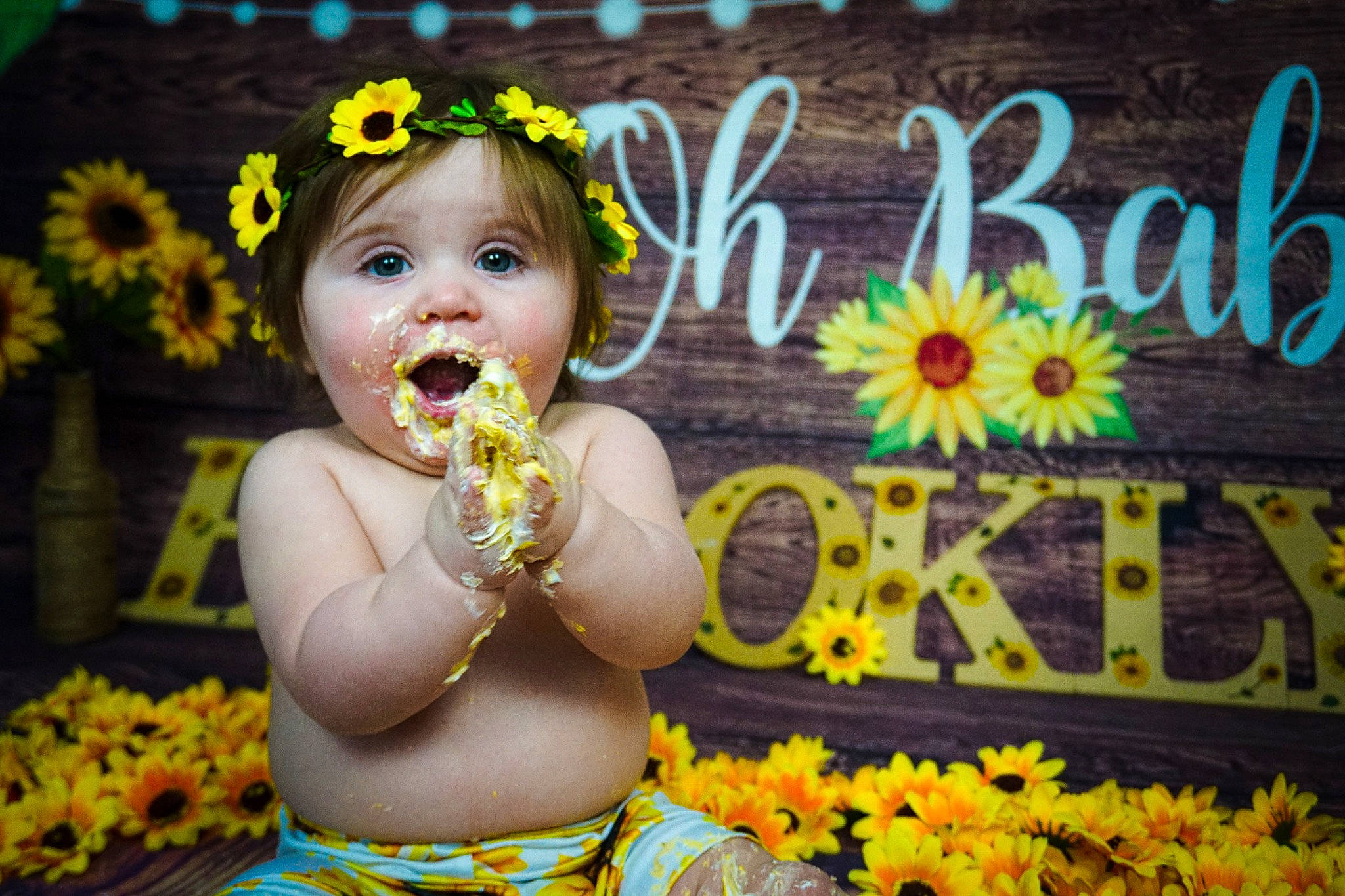 Brooklynn is registered to the contest to win money with this photo: adaptation, baby, beauty, flower, fun, grass, green, happy, iris, leaf, lei, organ, people_in_nature, person, petal, photograph, plant, smile, summer, toddler