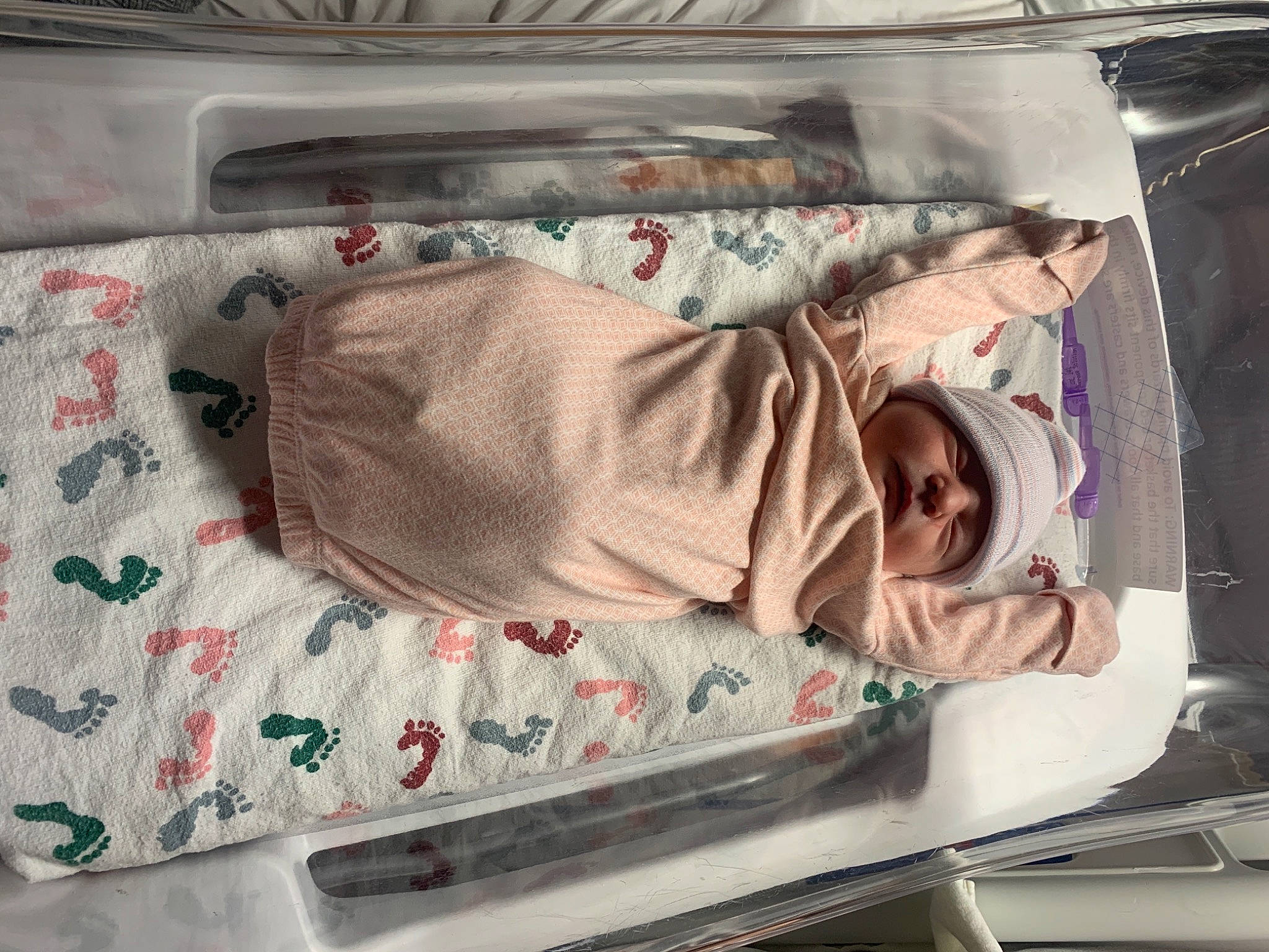 Amethyst is registered to the contest to win money with this photo: automotive_exterior, baby, baby_products, baby_safety, bed, bed_sheet, bedding, child, coffin, comfort, electronic_device, family_car, headwear, linens, motor_vehicle, person, product, room, textile, trunk