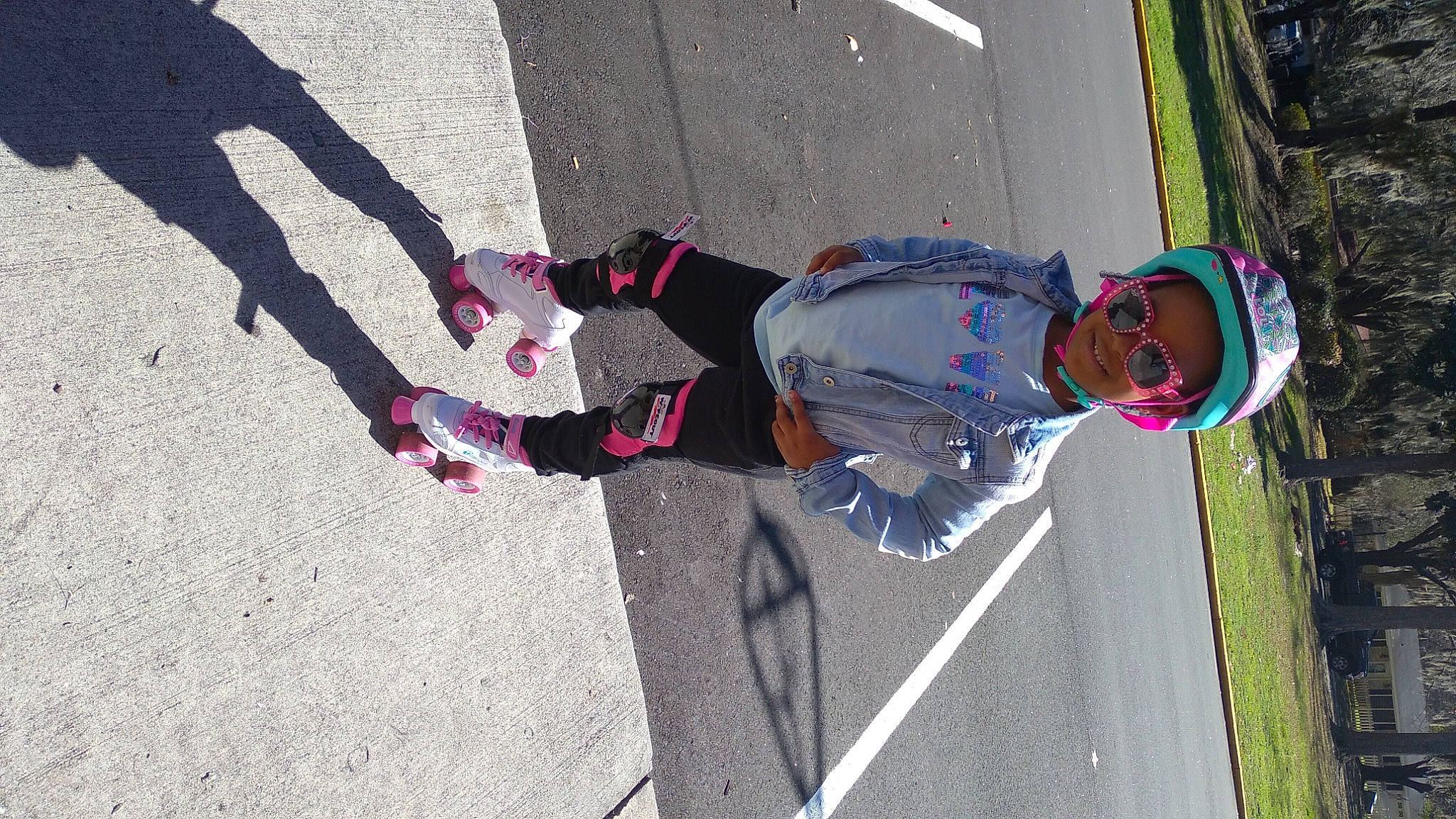 Adore is registered to the contest to win money with this photo: asphalt, carmine, child, fun, human_leg, joy, leisure, pedestrian, person, plant, recreation, road, road_surface, shadow, sidewalk, sock, street, tar, tire, toddler