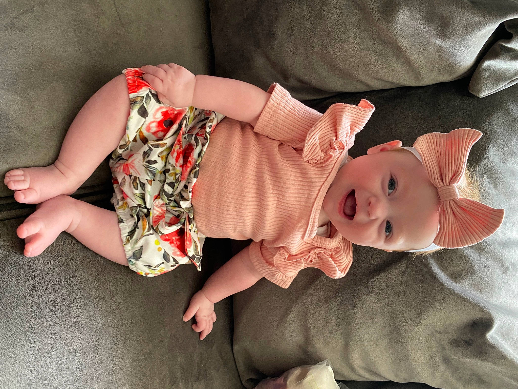 Imogen is registered to the contest to win money with this photo: baby, baby_products, baby_toddler_clothing, child, comfort, doll, eye, finger, hand, head, headwear, human_body, human_leg, leg, person, pink, skin, sleeve, smile, thigh
