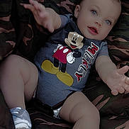 Asher joined the competition — help win amazing prizes! baby, infant, child, mickey_mouse, onesie, sneakers, camouflage, seat, reaching, blue_eyes, smiling, cute, outdoor, legs, hands, clothing, person, portrait, happy, young