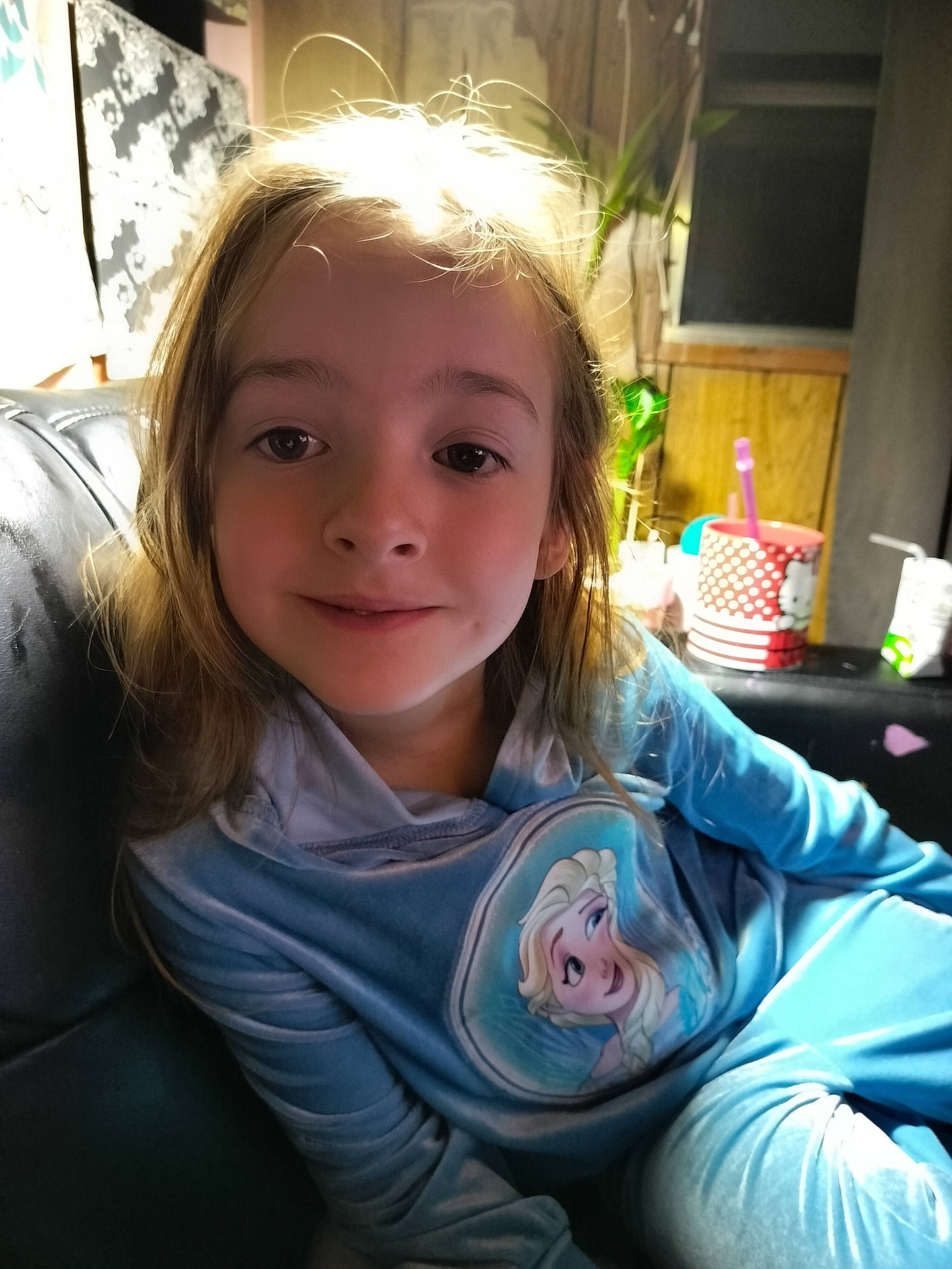 baby, blonde, child, clothing, coat, couch, cushion, face, female, furniture, girl, head, homedecor, knitwear, longsleeve, person, photography, portrait, sleeve, sweater