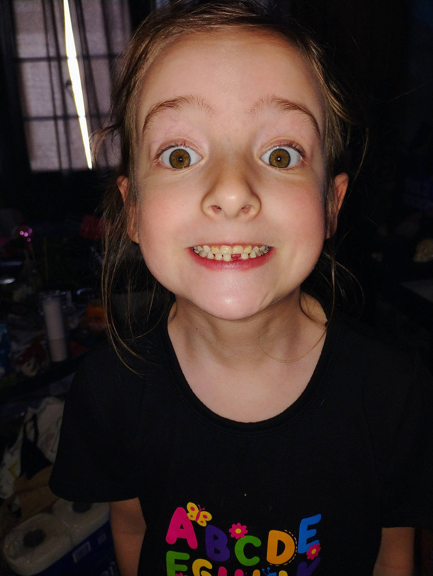 animal, applique, baby, bodypart, clothing, face, finger, hand, happy, head, invertebrate, mouth, pattern, person, photography, portrait, smile, spider, t_shirt, teeth