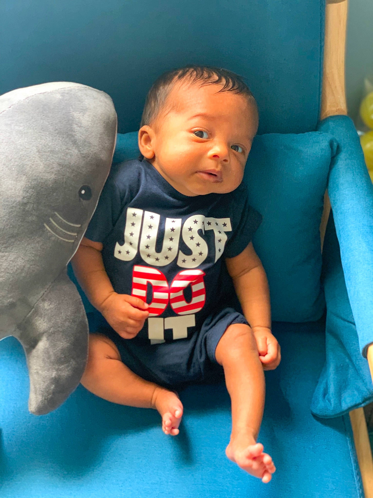 Zakai is registered to the contest to win money with this photo: arm, azure, baby, baby_toddler_clothing, comfort, face, finger, hairstyle, happy, head, human, human_body, joint, leg, mammal, mouth, person, skin, standing, thigh
