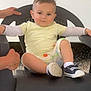 Djuan a rejoint le concours — aidez-le/la à gagner de superbes lots ! toddler, child, chair, plastic_chair, sitting, shoes, shorts, tshirt, outdoor, gravel, person, casual_clothing, young_child, hands, expression, relaxed, daylight, portrait, small_child, human