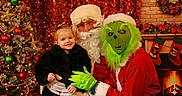Khaleecy joined the competition — help win amazing prizes! celebration, child, christmas_tree, costume, decorations, face, festive, fireplace, fur_coat, gloves, green, grinch, holiday, indoor, portrait, red, santa_claus, smile, stockings, toddler