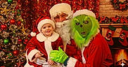 Khaleecy joined the competition — help win amazing prizes! beard, celebration, child, christmas_decorations, christmas_tree, festive, fireplace, glasses, green_mask, grinch, hat, holiday, indoor, people, portrait, red_clothing, santa_claus, smile, stockings, toddler