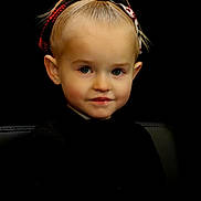 Khaleecy is registered to the contest to win money with this photo: black_background, blonde_hair, child, cute, earrings, expression, eyebrows, face, fashion, headband, headshot, innocent, looking_at_camera, person, portrait, sitting, smile, studio, toddler, young