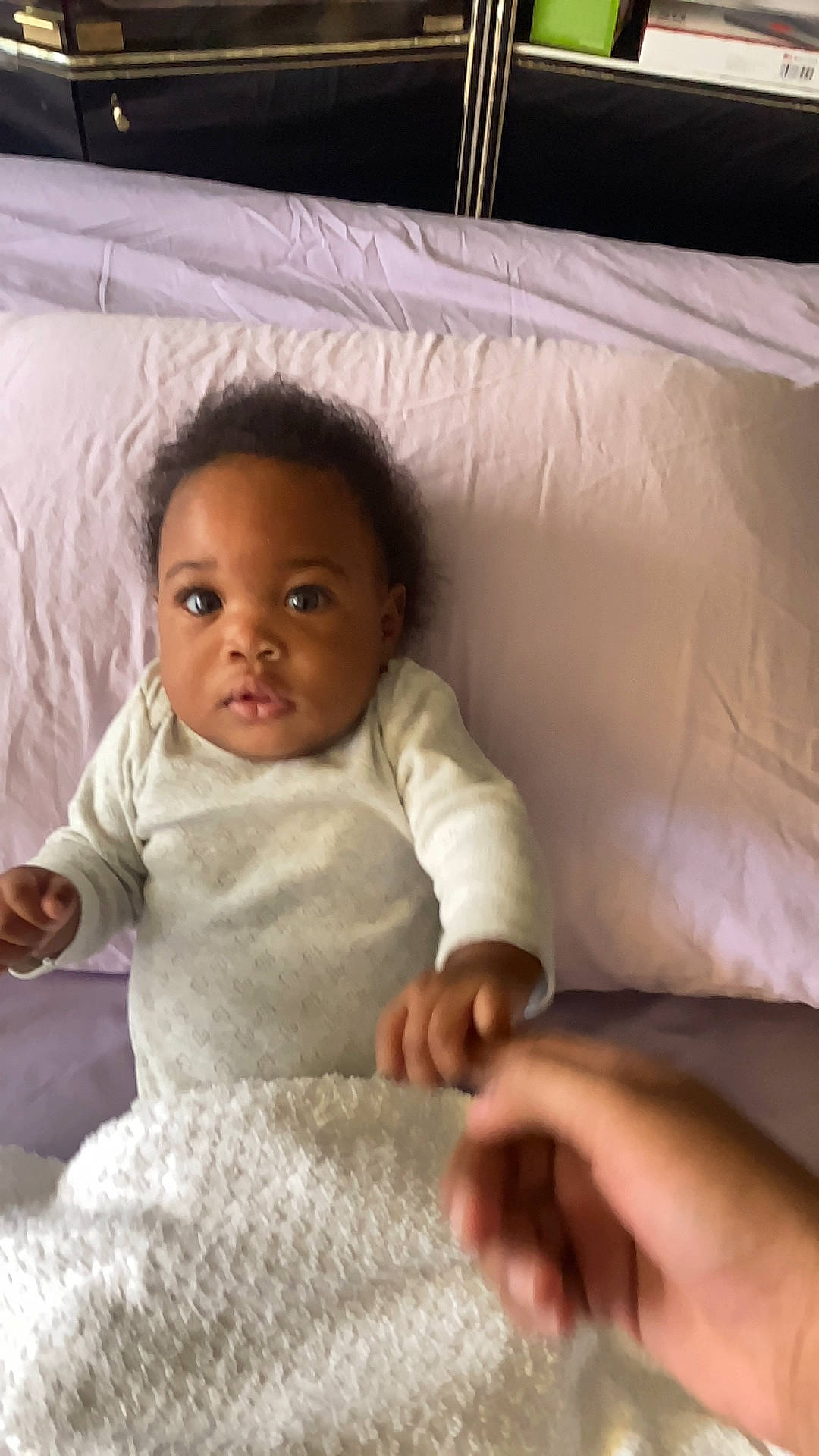 Malani is registered to the contest to win money with this photo: baby, baby_toddler_clothing, cheek, child, comfort, eye, eyebrow, facial_expression, finger, flooring, hairstyle, head, linens, nose, person, sitting, skin, sleeve, smile, textile