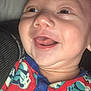Malachi is registered to the contest to win money with this photo: baby, smiling, closeup, face, child, infant, happy, apparel, clothing, pattern, red, blue, skin, head, tongue, eyes, person, cute, indoors, portrait