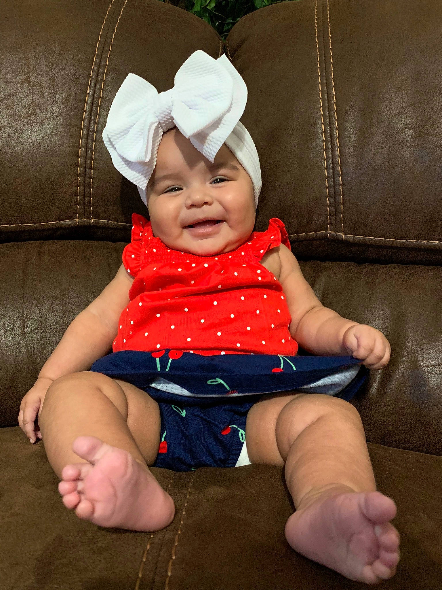 Celeste joined the competition — help win amazing prizes! baby, cheek, child, finger, hand, headgear, headwear, leg, person, sitting, skin, smile, toddler