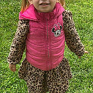 Alaiya is registered to the contest to win money with this photo: child, girl, smiling, standing, grass, outdoor, pink_vest, minnie_mouse, leopard_print, pigtails, shoes, happy, casual_clothing, nature, daylight, cute, portrait, young, fashion, feet